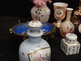 many different vases that are sitting on a table