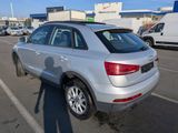 the rear end of a silver audi suv parked in a parking lot