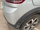 a close up of a car ' s rear end with a denting on it