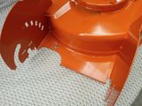 a close up of an orange blower on a chair