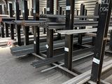 many metal racks in a warehouse with a lot of them