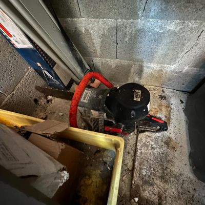 an image of a water heater in the corner of a room