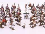a lot of figurines of people riding on horses