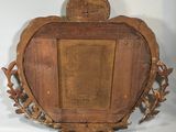a picture of a wooden picture frame with a crown on it