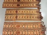 three pieces of cloth with different designs on them