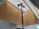 a lamp that is on top of a table in a room