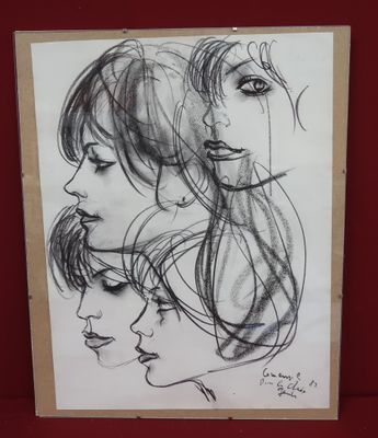 a drawing of a woman ' s face on a piece of paper