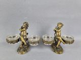 paire de figurines anciennes en laiton représentant des chérensils, sur lesquelles sont posés des chérensils