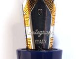 a fountain pen sitting on top of a blue vase