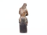 statue of a woman holding a book in her right hand