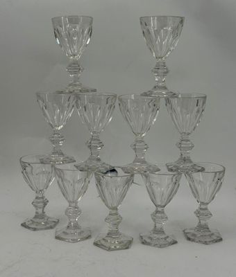 six clear glass goblets are stacked on top of each other
