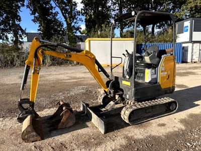 a small excavator that is sitting in the dirt