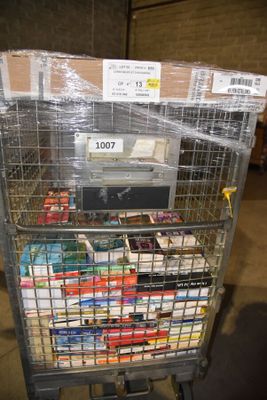 a shopping cart with many items in it in a warehouse
