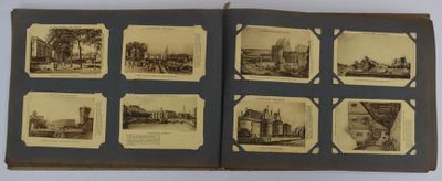 an old photo of a book with pictures of buildings and people