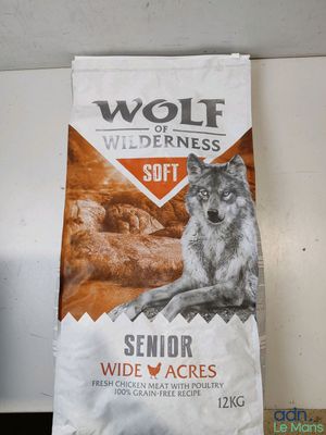 a bag of wolf wilderness soft dog food sitting on top of a counter