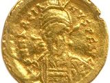 une pièce d'or à l'effigie d'une femme