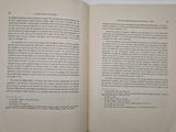 an open book on a table with a white background