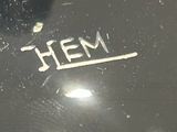 a close up of a metal object with the word hem written on it