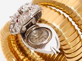 an image of a close up of a ring with a watch on top of it