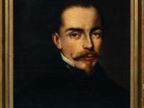 a painting of a man with a mustache in a gold frame