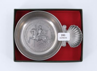 an image of a silver plate with a horse and rider on it in a red box