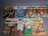 several children ' s cartoon books are lined up on a table