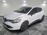 the white car is parked on a checkered floor in the garage