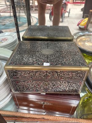 a wooden box that is sitting on top of a glass table