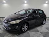 the small black car is parked in a large room