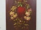 une peinture représentant une couronne de fleurs accrochée à un mur