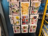 a display of greeting cards on a rack in a store