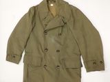 an image of a green jacket with buttons on the collar