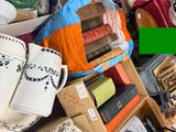 a pile of books and other items on a table