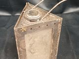 an old fashioned wooden box with a metal handle on a black cloth