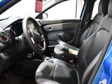 the interior of a blue car with black leather seats and a steering wheel