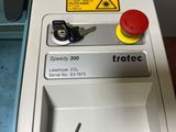 a close up of a machine that has a red button on it