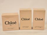 three boxes of chloe perfume sitting next to each other on a table