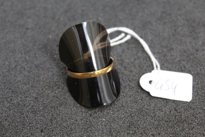 a ring that is sitting on a table with a price tag