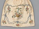an old bag with a bird and flowers design on it