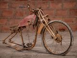 a old motorcycle that is sitting on the ground