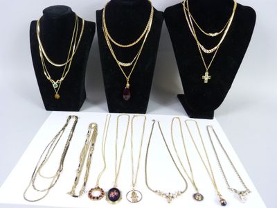 several necklaces and bracelets are displayed on display on a table