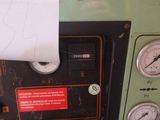 a picture of a machine with a paper taped to it ' s side