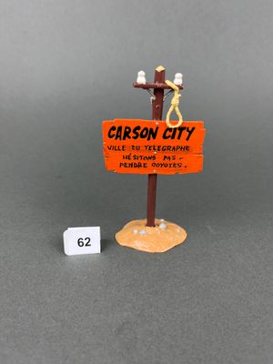 a small sign with a figure on it next to a small sign