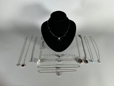 necklaces, bracelets, and necklaces are displayed on a table