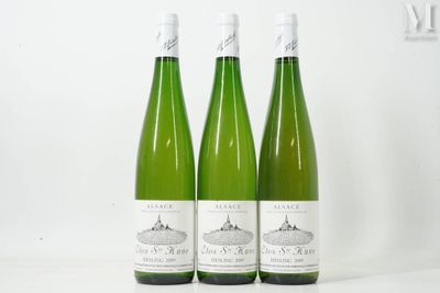 three bottles of wine sitting next to each other on a table