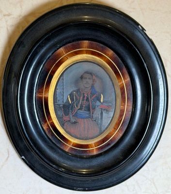 a picture of a woman in a red dress in a black frame