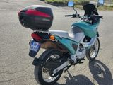 a motorcycle that is parked on the side of the road