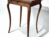 a small wooden table with a marble top on a white background