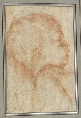 drawing of a man ' s head in a frame on a wall