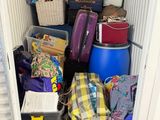 a small storage room with a lot of bags and luggage